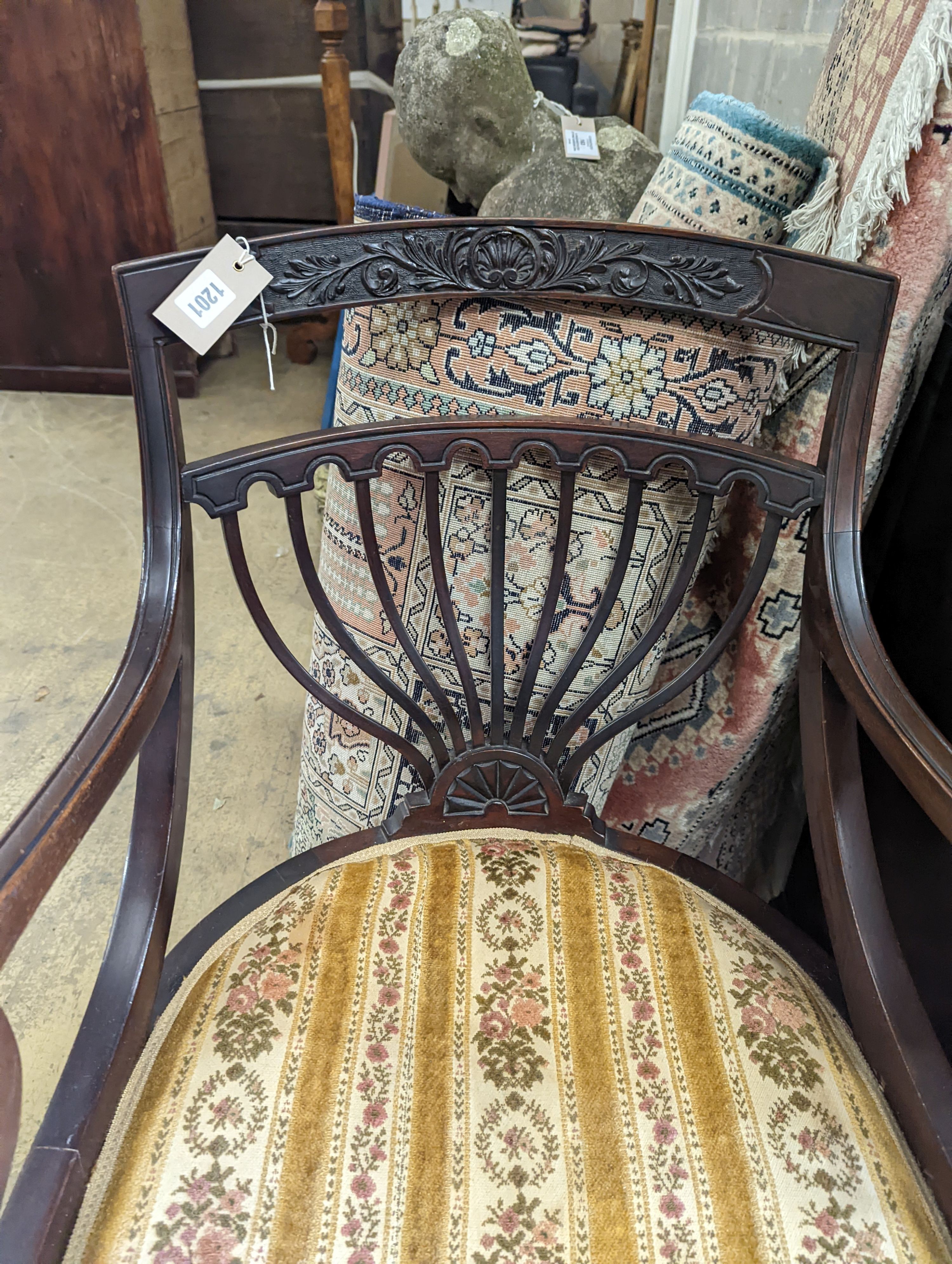 A late Victorian carved mahogany elbow chair